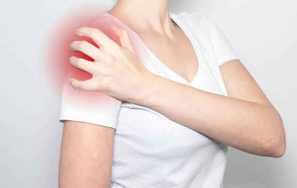 istock Hand holding pain point, suffering from shoulder ache. Trauma 1287030063
