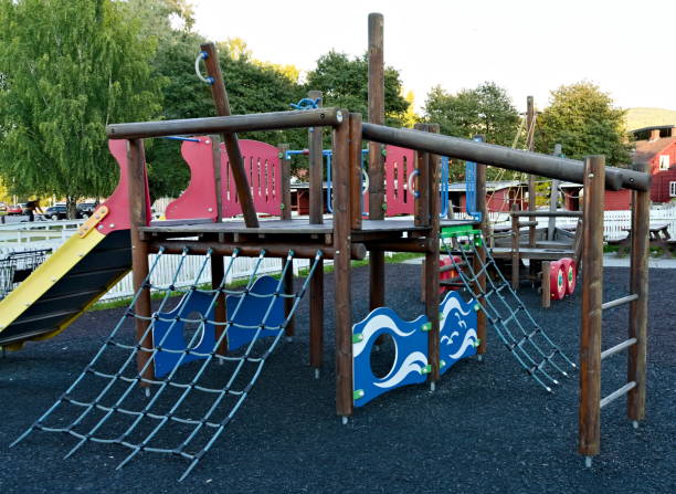 istock Empty public playground with slides and climbing devices. 1287031555