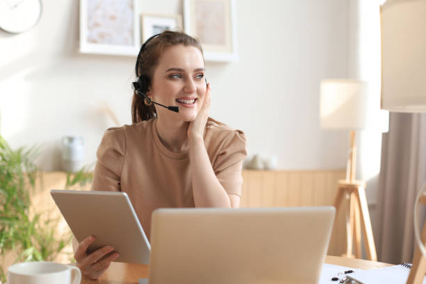 istock Freelance business women using tablet working call video conference with customer in workplace at home. 1287032904