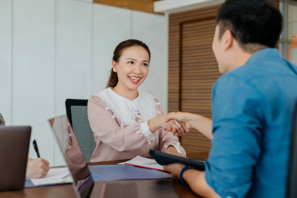 istock Business people shaking hands in a meeting 1287033154