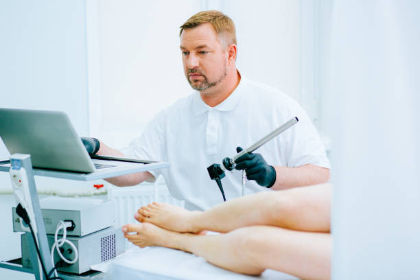 istock Serious medical worker with tool for rectal examination 1287035486