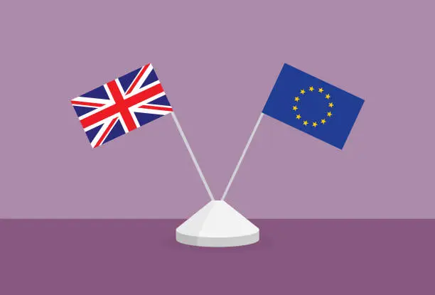Vector illustration of UK and Euro flag on a table