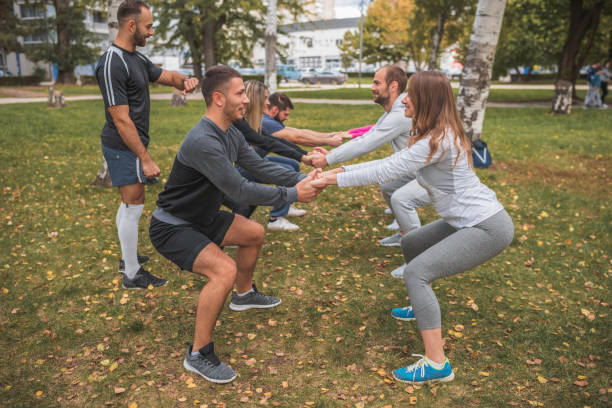 istock Happy people exercising in pairs 1287036415