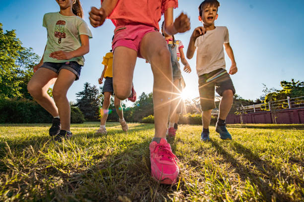 istock Close-up kids running in park 1287037972