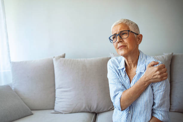 istock Senior woman with shoulder pain. 1287040121