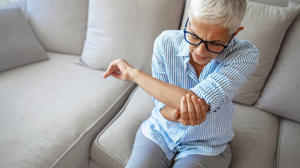 istock Senior woman with arm pain. 1287040205