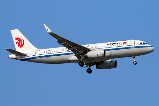 An Airbus A320 operated by Air China lands in Shanghai Pudong airport.