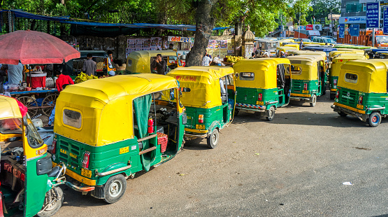 New Delhi / India - September 2019: Tuk Tuks in the streets of New Delhi, India