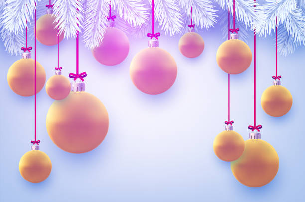 istock Matt pink and orange christmas balls hanging on ribbons. 1287042999