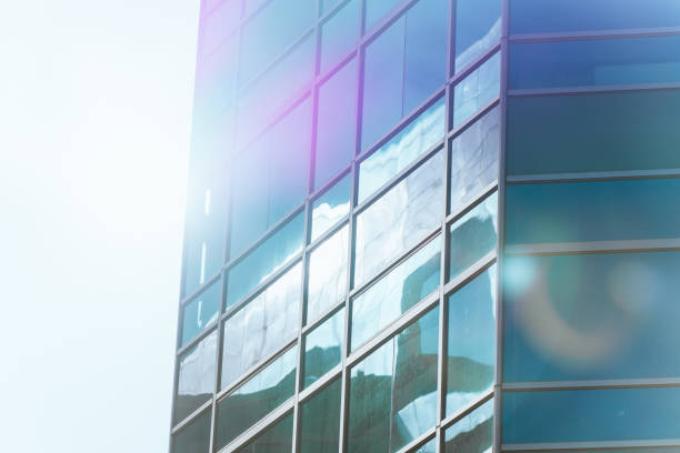 istock underside panoramic and perspective view to steel blue glass high rise building skyscrapers, business concept of successful industrial architecture 1287044492
