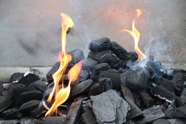 istock flames between charcoals in the barbeque grill 1287047064