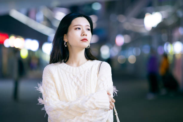 istock Sad woman in city night 1287047264