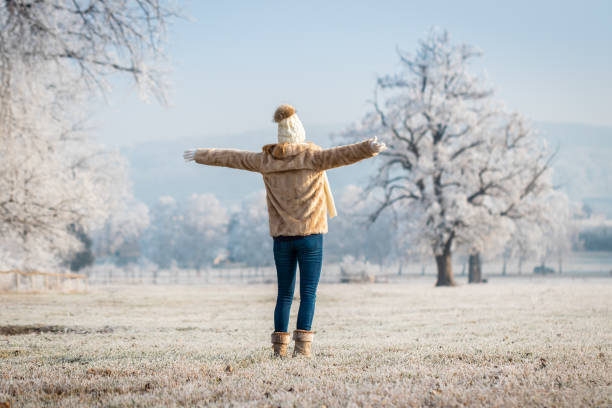 istock Happy woman enjoying winter nature 1287047799