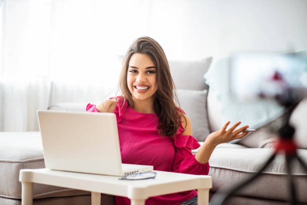 istock Young beautiful woman recording content for her vlog 1287048593