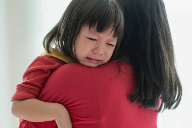 istock Asian little girl sad and crying 1287053206