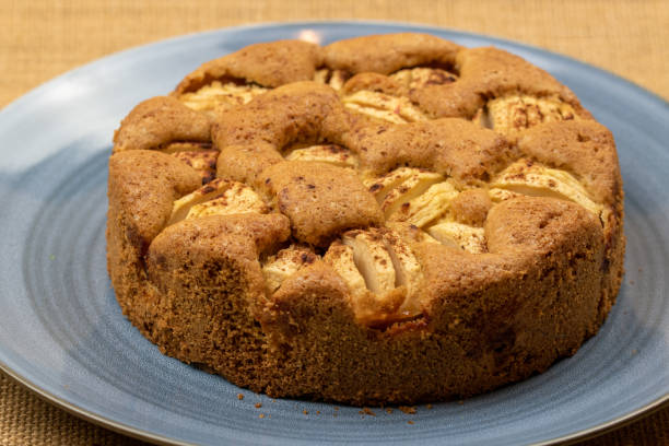 istock Freshly baked apple pie on a blue plate. 1287053725