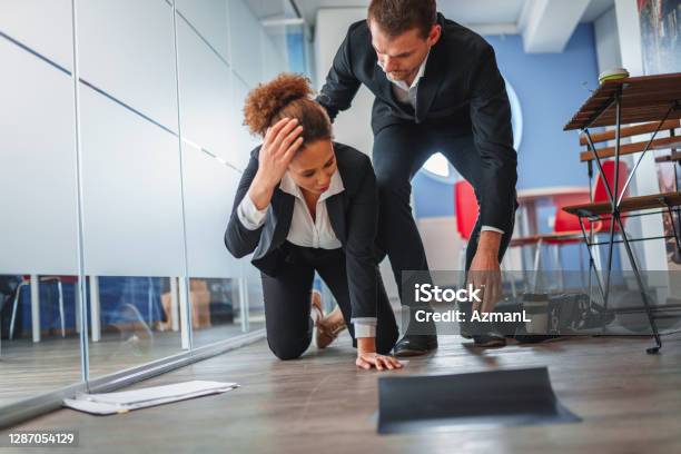 Africanamerican Businesswoman Falling And Dropping Papers In An Office Stock Photo - Download Image Now