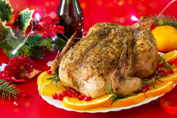 istock Winter Holiday table Christmas dinner. Baked turkey on red background. 1287054763