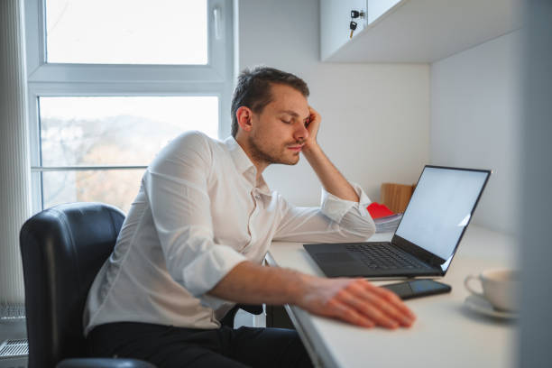 istock Caucasian Businessman Falling a Sleep in an Office 1287054913