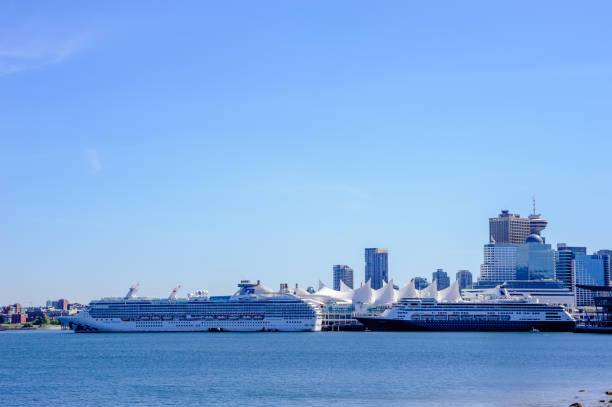 Vancouver, BC, Canada - May 08, 2019: Cruise ships docked at the city's main passenger terminal near downtown.