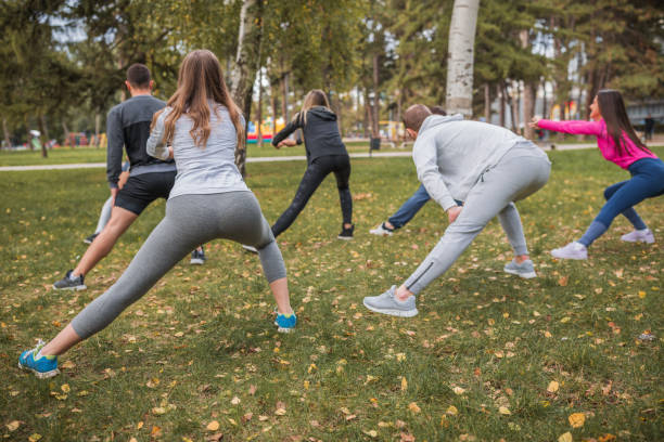 istock Fitness group exercising outdoors 1287057110