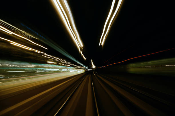 istock Abstract long exposure city motion light trails 1287058701