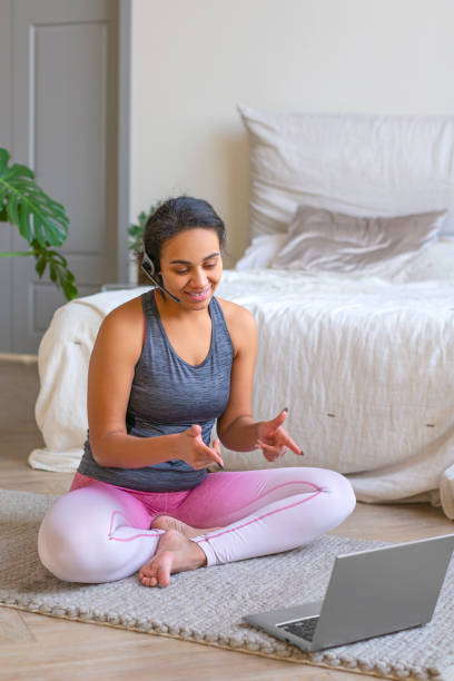 istock Senior woman prepares for workouts on the Internet 1287061275