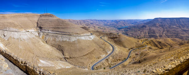 Winding road and beautiful desert landscape, mount Nebo Jordan the jordanian and desert landscape with the winding road to Mount Nebo mount nebo jordan stock pictures, royalty-free photos & images