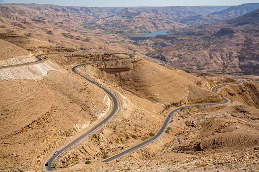 the jordanian and desert landscape with the winding road to Mount Nebo