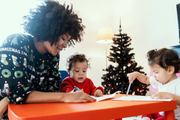 istock Mom and babies at home for Christmas 1287064700
