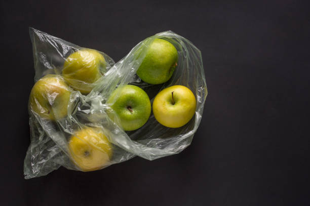 istock green apples in a  plastic crumpled cellophane bag on a dark background top view 1287065237