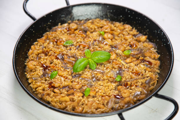 istock Traditional spanish paella with vegetables and chicken. 1287067400