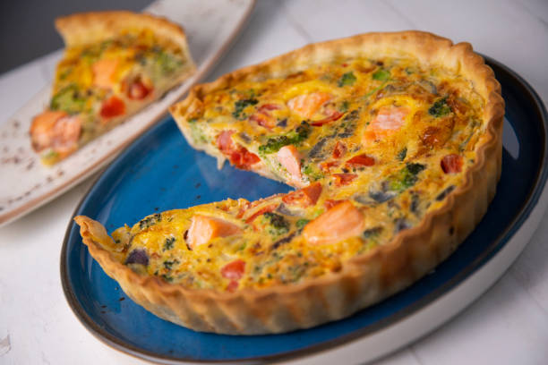 istock Traditional salmon quiche with broccoli and vegetables 1287068000