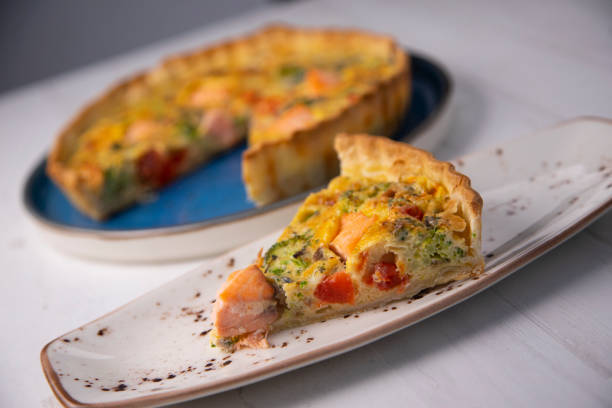 istock Traditional salmon quiche with broccoli and vegetables 1287068114