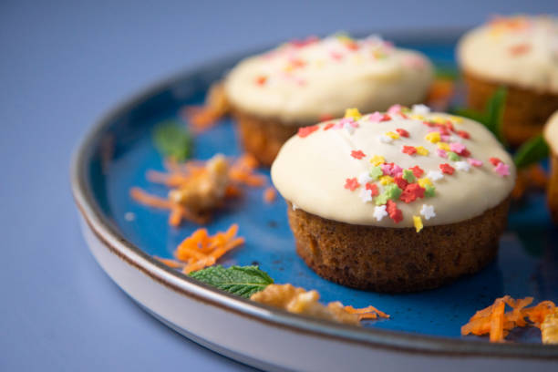 istock Mini carrot cake with white chocolate cover and sprinkles 1287068302