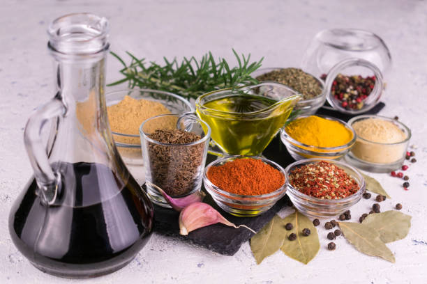 istock Many different spices and sauces on a white table. 1287068379