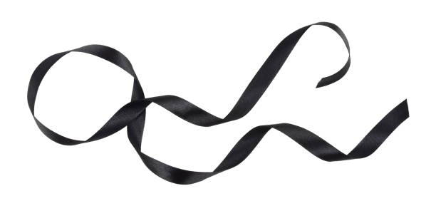 istock Waved black silk ribbon isolated on white 1287068461