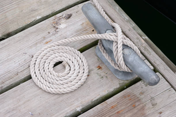 istock Weathered coastal dock on the maine coast with cleat and rope 1287073104