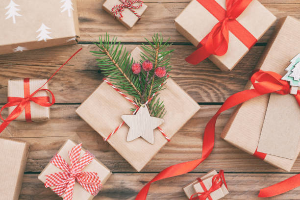 istock Many Handmade zero waste Christmas gift boxes on wooden background. Christmas background with Christmas decorations. 1287073794