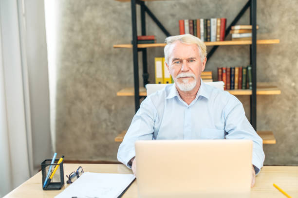 istock Senior grey haired man in smart casual wear 1287074726