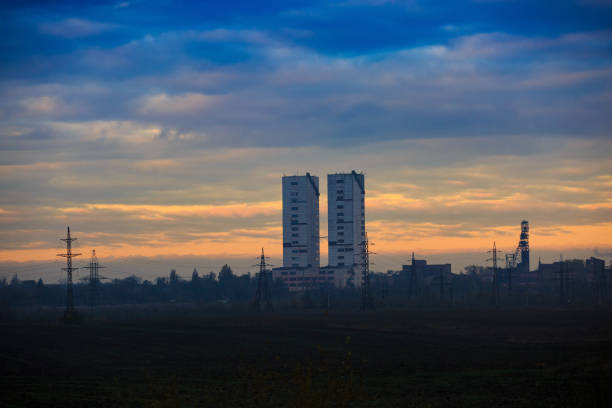 Ore or coal mine twin towers at dawn or dusk
