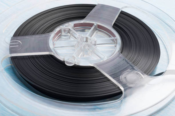 istock old magnetic cassette lies on a blue background, close-up top view 1287075219