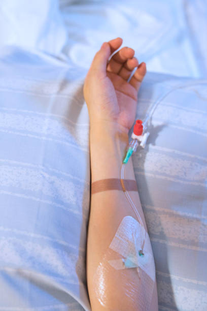 istock A woman's arm receiving an IV drip 1287075345