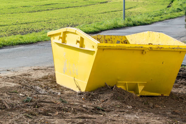 istock A yellow skip, container is loaded with rubble and wood. 1287076092