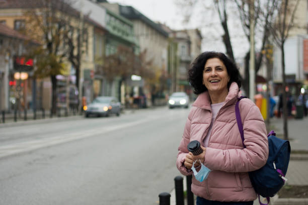 istock Woman holding a cup of coffee 1287076981