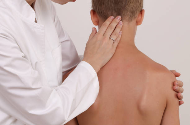 istock Physiotherapist exam for teenage boy. Manual Muscles Tests and Posture Checking . Preventive Health Care Visits in Children 1287077000