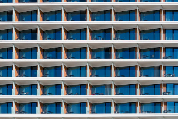 Praia da Falesia, Albufeira, Algarve, Portugal -  26 March 2020: Empty balconies in a touristic resort on the Algarve Coast. Photo made from Falesia Beach, a popular travel destination in Portugal. COVID-19 presents the tourism sector evolving challenge.