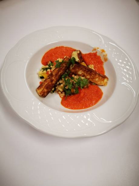istock Bulgur with omelet and a tomato sauce 1287077898