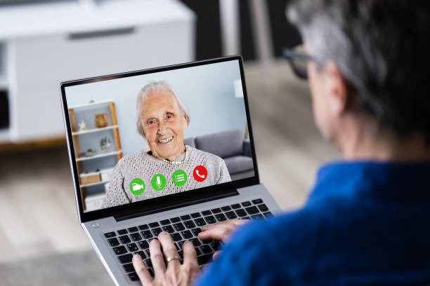 istock Elderly Man Video Conferencing With Mother 1287080104