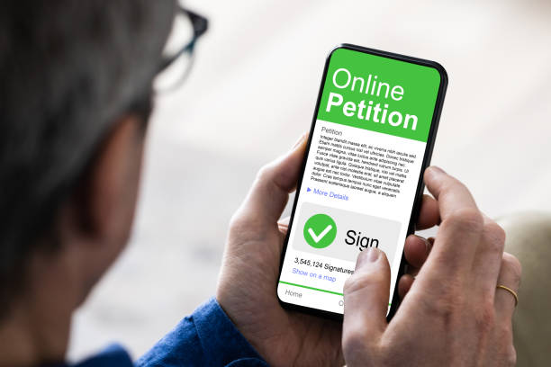 istock Elderly Senior Hand Signing Petition 1287080138